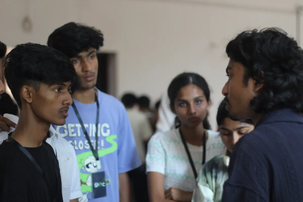 A cluster of students talking between sessions